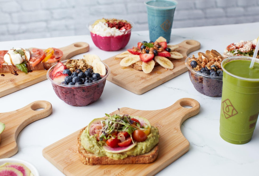 Healthy brunch spread with avocado toast and smoothie bowls enjoyed at a fresh and fast brunch in East Cobb.