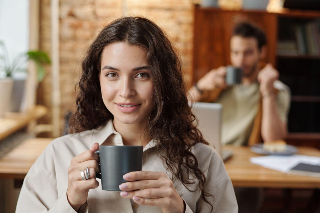 Woman enjoying a fresh mug before a meeting, the kind of calm you’ll find at coffee shops in Dupont Circle DC.